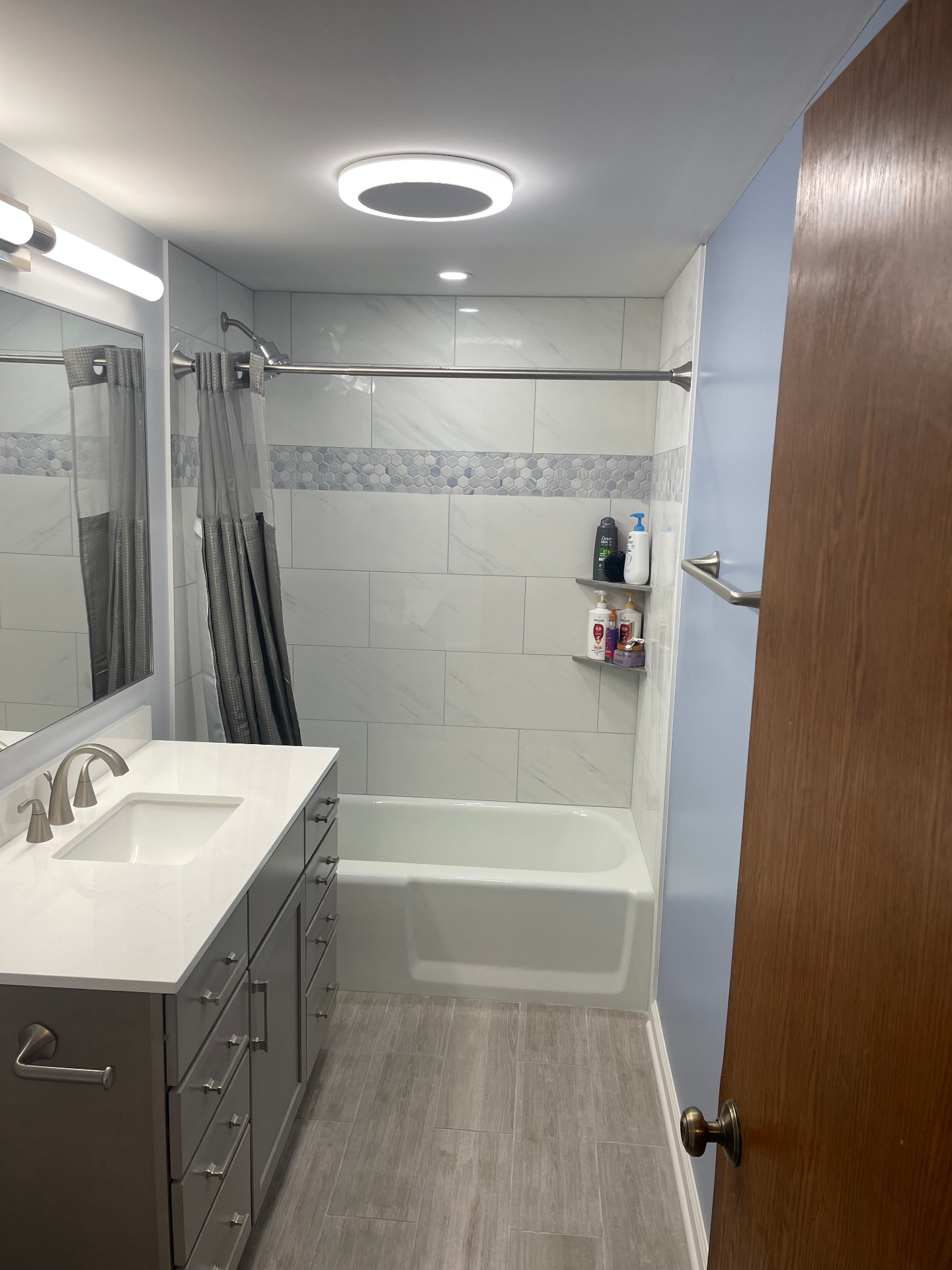 Marble-Look Hall Bath Remodel — Chicago, IL