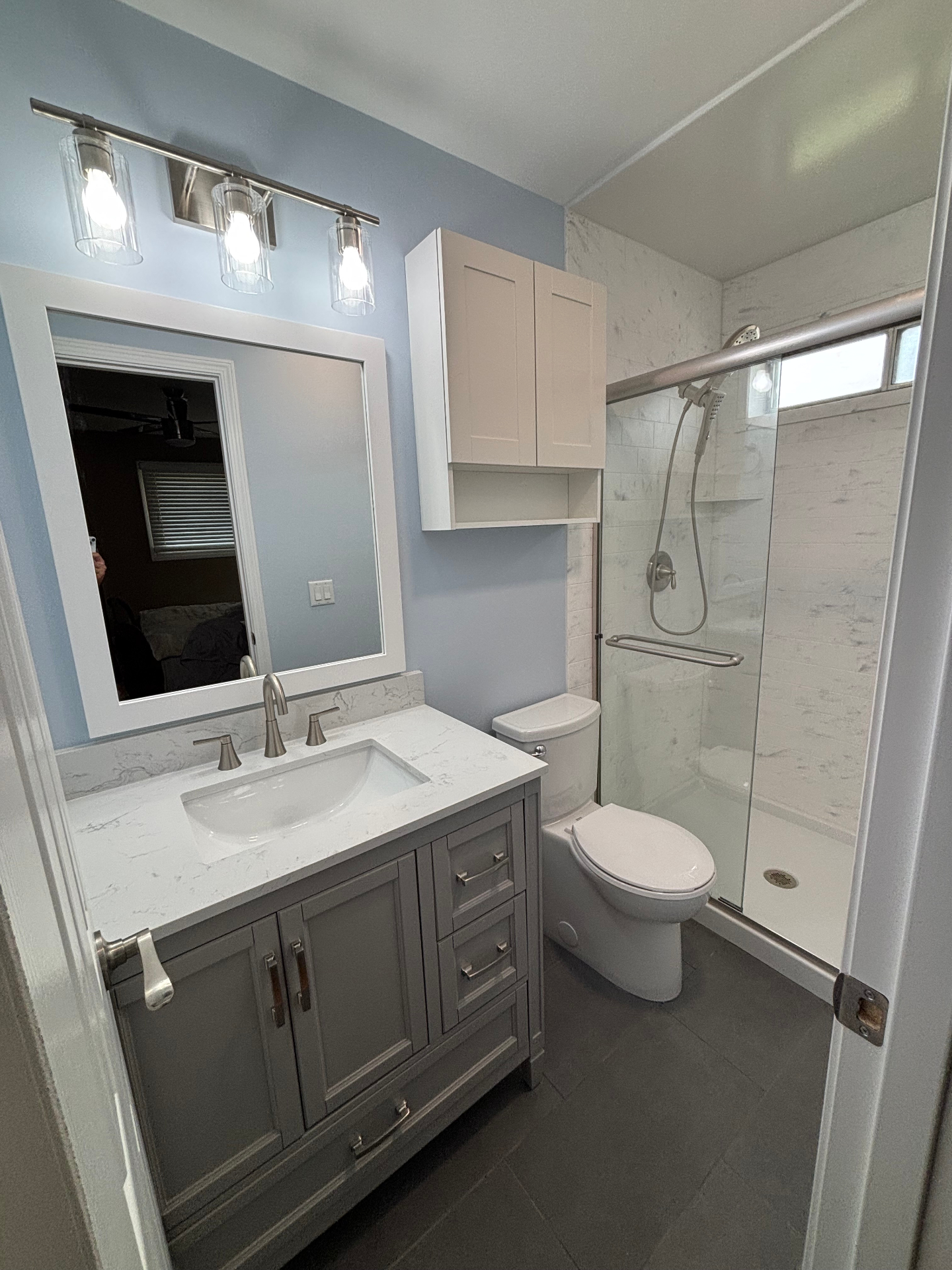 Soft Blue Hall Bath Refresh — Mount Prospect, IL